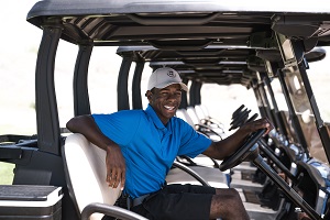 man on golf cart